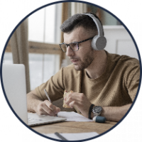 young-man-studying-library-using-laptop